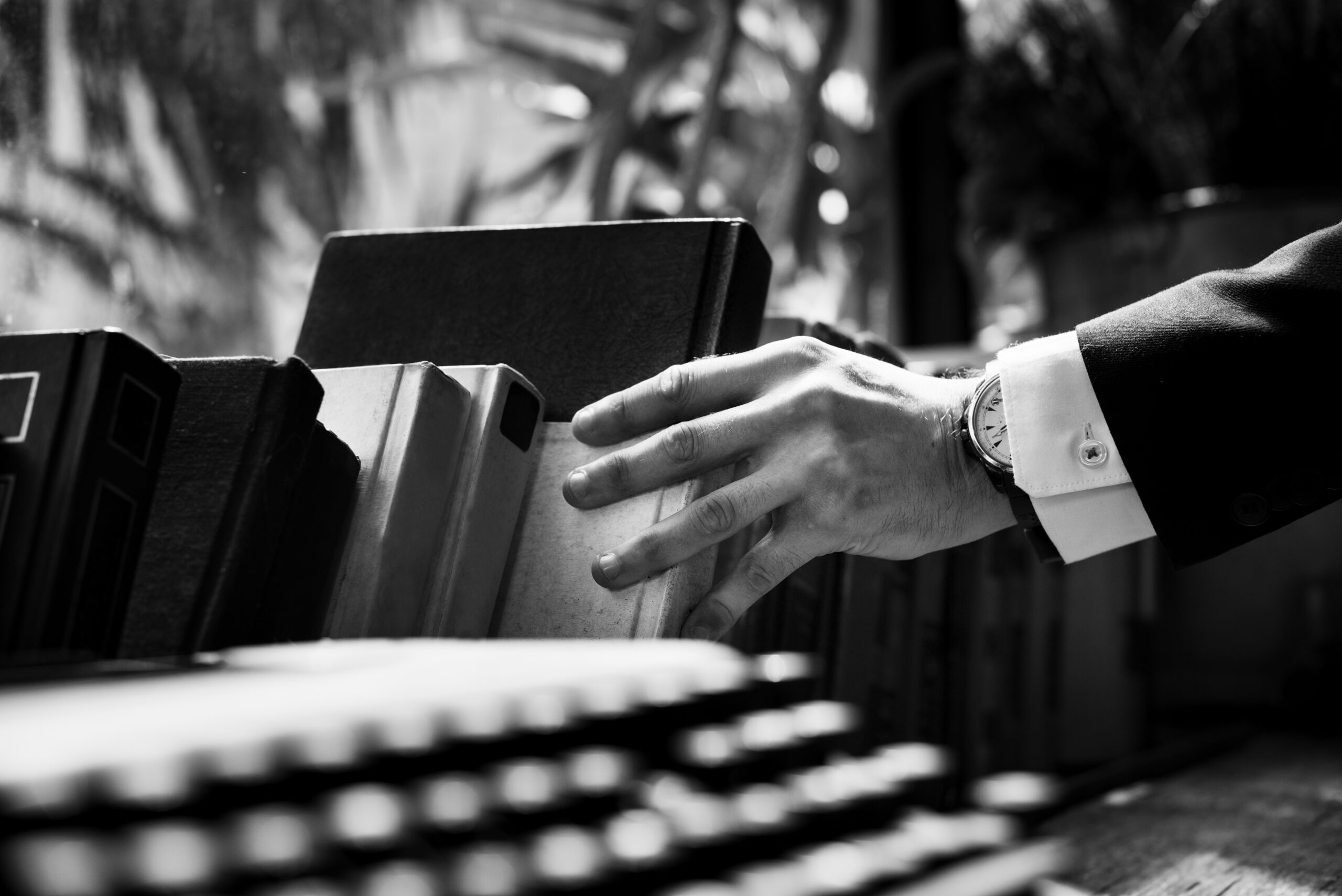 closeup hand getting book scaled